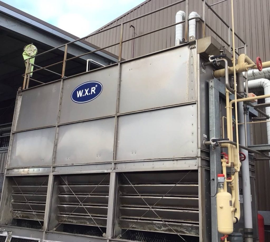 WXR industrial cooling tower WXR cooling tower installed at an industrial facility providing heat rejection for the site’s cooling water system.